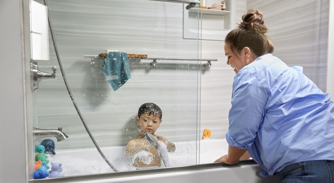 young boy bathing in bathtub